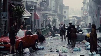 Movie still from “Blindness” (2008), directed by Fernando Meirelles – A group of people standing on the side of a road; Extreme Wide shot, High angle
