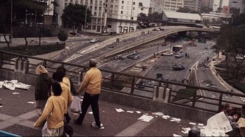 Movie still from “Blindness” (2008), directed by Fernando Meirelles – A group of people walking across a bridge; Extreme Wide shot, High angle