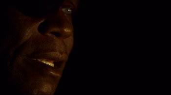 Movie still from “Blindness” (2008), directed by Fernando Meirelles – A man's face in the dark; Extreme Close Up shot, Low angle