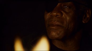 Movie still from “Blindness” (2008), directed by Fernando Meirelles – A person wearing a black shirt; Extreme Close Up shot, Low angle