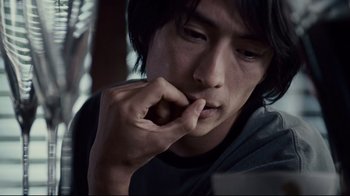 Movie still from “Blindness” (2008), directed by Fernando Meirelles – A person with his hand to his face; Close Up shot, Low angle