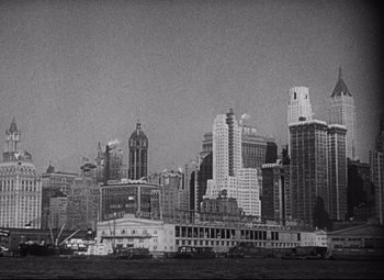Movie still from “Blonde Venus” (1932), directed by Josef von Sternberg – A black - and - white photo of a city skyline; Extreme Wide shot, High angle
