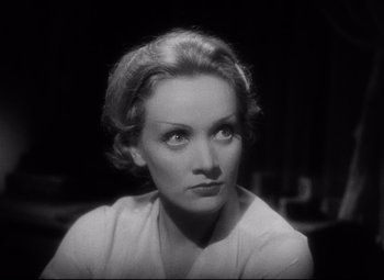 Movie still from “Blonde Venus” (1932), directed by Josef von Sternberg – An old photo of a woman looking at the camera; Close Up shot, High angle