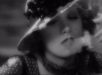 Movie still from “Blonde Venus” (1932), directed by Josef von Sternberg – A black and white photo of a woman in a hat; Close Up shot, High angle