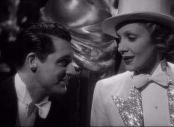 Movie still from “Blonde Venus” (1932), directed by Josef von Sternberg – A black and white photo of a man and a woman; Close Up shot, Low angle