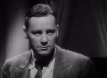 Movie still from “Blonde Venus” (1932), directed by Josef von Sternberg – An old photo of a man in a suit; Close Up shot, Low angle