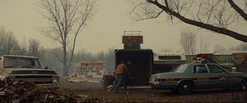 Movie still from “Blood Quantum” (2019), directed by Jeff Barnaby – A man is walking in front of a bus; Extreme Wide shot, Over the shoulder angle