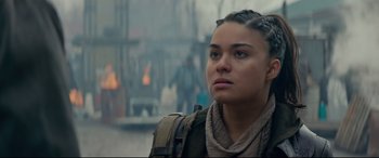 Movie still from “Blood Quantum” (2019), directed by Jeff Barnaby – A woman with a backpack looking to her left; Close Up shot, Over the shoulder angle