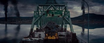 Movie still from “Blood Quantum” (2019), directed by Jeff Barnaby – A bridge that has a sign that says " welcome to hull baster "; Extreme Wide shot, High angle