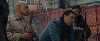 Movie still from “Blood Quantum” (2019), directed by Jeff Barnaby – A man holding a sword in his hand while sitting next to a woman; Medium shot, Over the shoulder angle