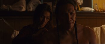 Movie still from “Blood Quantum” (2019), directed by Jeff Barnaby – A man and a woman are looking at each other; Close Up shot, Over the shoulder angle