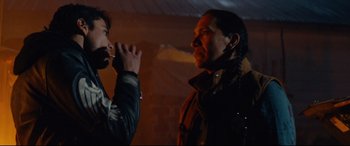 Movie still from “Blood Quantum” (2019), directed by Jeff Barnaby – A man and a woman standing next to each other in a room; Medium shot, Over the shoulder angle