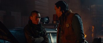 Movie still from “Blood Quantum” (2019), directed by Jeff Barnaby – Two men are standing next to each other; Medium shot, Over the shoulder angle
