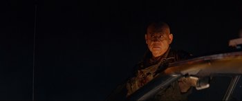 Movie still from “Blood Quantum” (2019), directed by Jeff Barnaby – An old man with a bald head is looking at the camera; Close Up shot, Low angle