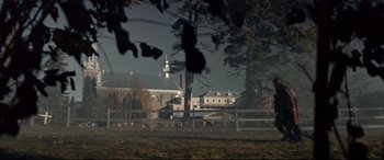 Movie still from “Blood Quantum” (2019), directed by Jeff Barnaby – A view of a building from across a field; Extreme Wide shot, Low angle