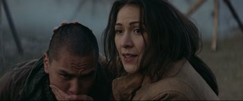 Movie still from “Blood Quantum” (2019), directed by Jeff Barnaby – A man and a woman looking at the camera; Close Up shot, Over the shoulder angle