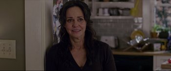 Movie still from “The Amazing Spider-Man” (2012), directed by Marc Webb – A person with long black hair; Close Up shot, Over the shoulder angle