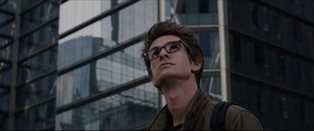 Movie still from “The Amazing Spider-Man” (2012), directed by Marc Webb – A man wearing glasses looking up at the sky; Close Up shot, Low angle