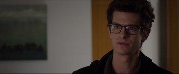 Movie still from “The Amazing Spider-Man” (2012), directed by Marc Webb – A young man wearing glasses and a black jacket; Close Up shot, Over the shoulder angle