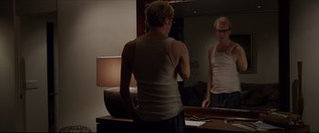 Movie still from “The Amazing Spider-Man” (2012), directed by Marc Webb – A man standing in front of a bathroom mirror; Medium shot, Over the shoulder angle