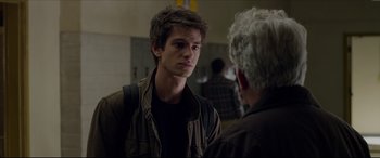 Movie still from “The Amazing Spider-Man” (2012), directed by Marc Webb – A young man talking to an older man in a room; Close Up shot, Over the shoulder angle