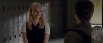 Movie still from “The Amazing Spider-Man” (2012), directed by Marc Webb – A woman with blonde hair and blue eye shadow; Close Up shot, Over the shoulder angle