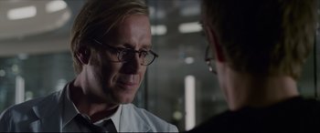Movie still from “The Amazing Spider-Man” (2012), directed by Marc Webb – A man wearing glasses talking to another man; Close Up shot, Over the shoulder angle