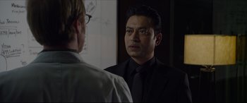 Movie still from “The Amazing Spider-Man” (2012), directed by Marc Webb – A man in a suit and tie looking into a mirror; Close Up shot, Over the shoulder angle