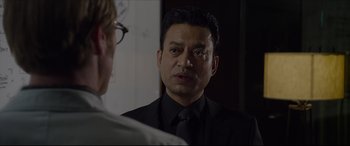 Movie still from “The Amazing Spider-Man” (2012), directed by Marc Webb – A man wearing a black suit and a tie; Close Up shot, Over the shoulder angle