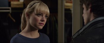 Movie still from “The Amazing Spider-Man” (2012), directed by Marc Webb – A woman with blonde hair wearing a blue sweater; Close Up shot, Over the shoulder angle
