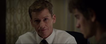 Movie still from “The Amazing Spider-Man” (2012), directed by Marc Webb – A person wearing a shirt and tie; Close Up shot, Over the shoulder angle