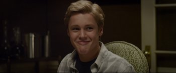 Movie still from “The Amazing Spider-Man” (2012), directed by Marc Webb – A person smiling for the camera; Close Up shot, Over the shoulder angle