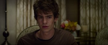 Movie still from “The Amazing Spider-Man” (2012), directed by Marc Webb – A young man is looking into the camera; Close Up shot, Over the shoulder angle