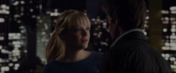 Movie still from “The Amazing Spider-Man” (2012), directed by Marc Webb – A man and a woman standing next to each other in front of a city skyline at night; Close Up shot, Over the shoulder angle