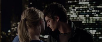 Movie still from “The Amazing Spider-Man” (2012), directed by Marc Webb – A man and a woman face to face in the dark; Close Up shot, Over the shoulder angle