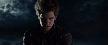 Movie still from “The Amazing Spider-Man” (2012), directed by Marc Webb – A young man in a black shirt is looking at the camera; Close Up shot, Low angle