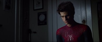 Movie still from “The Amazing Spider-Man” (2012), directed by Marc Webb – A young man in a spider - man costume looking sad; Close Up shot, Low angle