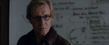 Movie still from “The Amazing Spider-Man” (2012), directed by Marc Webb – A person wearing glasses and a jacket; Close Up shot, Over the shoulder angle