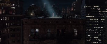 Movie still from “The Amazing Spider-Man” (2012), directed by Marc Webb – A man standing on top of a building at night; Extreme Wide shot, High angle