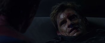 Movie still from “The Amazing Spider-Man” (2012), directed by Marc Webb – A man with blood all over his face and head; Close Up shot, Over the shoulder angle
