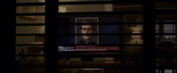 Movie still from “The Amazing Spider-Man” (2012), directed by Marc Webb – A television screen with a picture of a man on it; Extreme Close Up shot, Over the shoulder angle