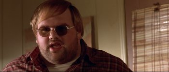Movie still from “Blow” (2001), directed by Ted Demme – A person wearing sunglasses; Close Up shot, High angle