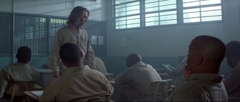 Movie still from “Blow” (2001), directed by Ted Demme – A group of people sitting in a room; Wide shot, Over the shoulder angle