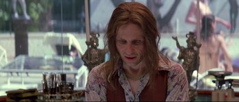 Movie still from “Blow” (2001), directed by Ted Demme – A person with long brown hair; Close Up shot, Over the shoulder angle