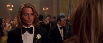 Movie still from “Blow” (2001), directed by Ted Demme – A group of men in suits and ties at an event; Close Up shot, Over the shoulder angle