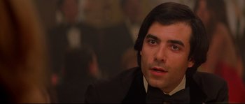 Movie still from “Blow” (2001), directed by Ted Demme – A person wearing a suit and tie; Close Up shot, Over the shoulder angle