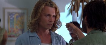 Movie still from “Blow” (2001), directed by Ted Demme – A person with long hair; Close Up shot, Over the shoulder angle