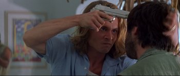 Movie still from “Blow” (2001), directed by Ted Demme – A person brushing his hair; Close Up shot, Overhead angle