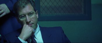 Movie still from “Blow” (2001), directed by Ted Demme – A person wearing a suit and tie; Close Up shot, Low angle