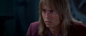 Movie still from “Blow” (2001), directed by Ted Demme – A person with long hair; Close Up shot, Over the shoulder angle